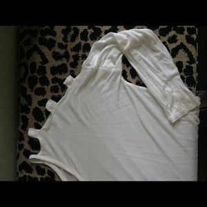 Off white top with cut outs on sleeves.Make offer
